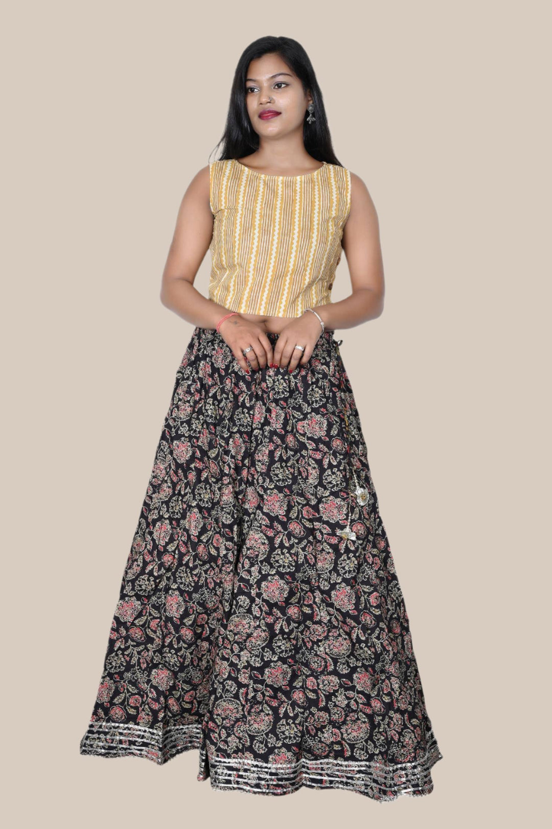 Women's black floral long maxi skirt with adjustable dori waist, perfect for casual and festive wear.