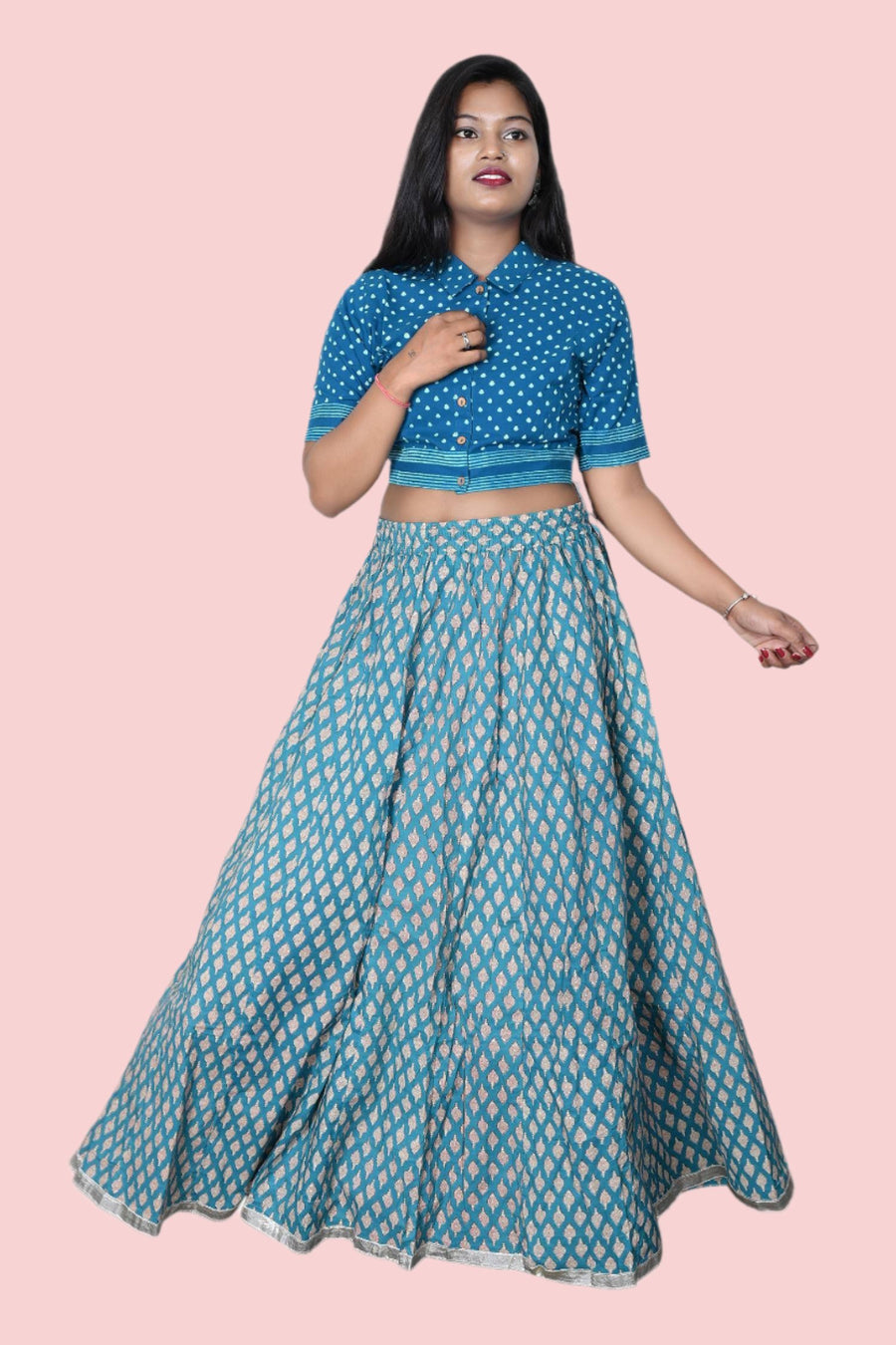 Elegant blue floral long skirt with lace border and adjustable dori, offering a fashionable and comfortable fit for women.