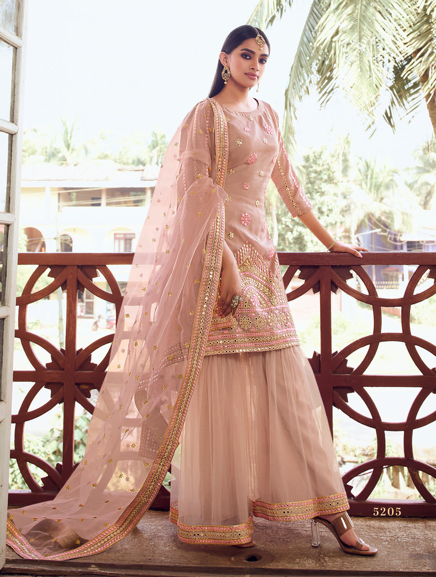 Designer light peach Sharara suit with intricate thread, mirror, and zari embroidery, ideal for special occasions.