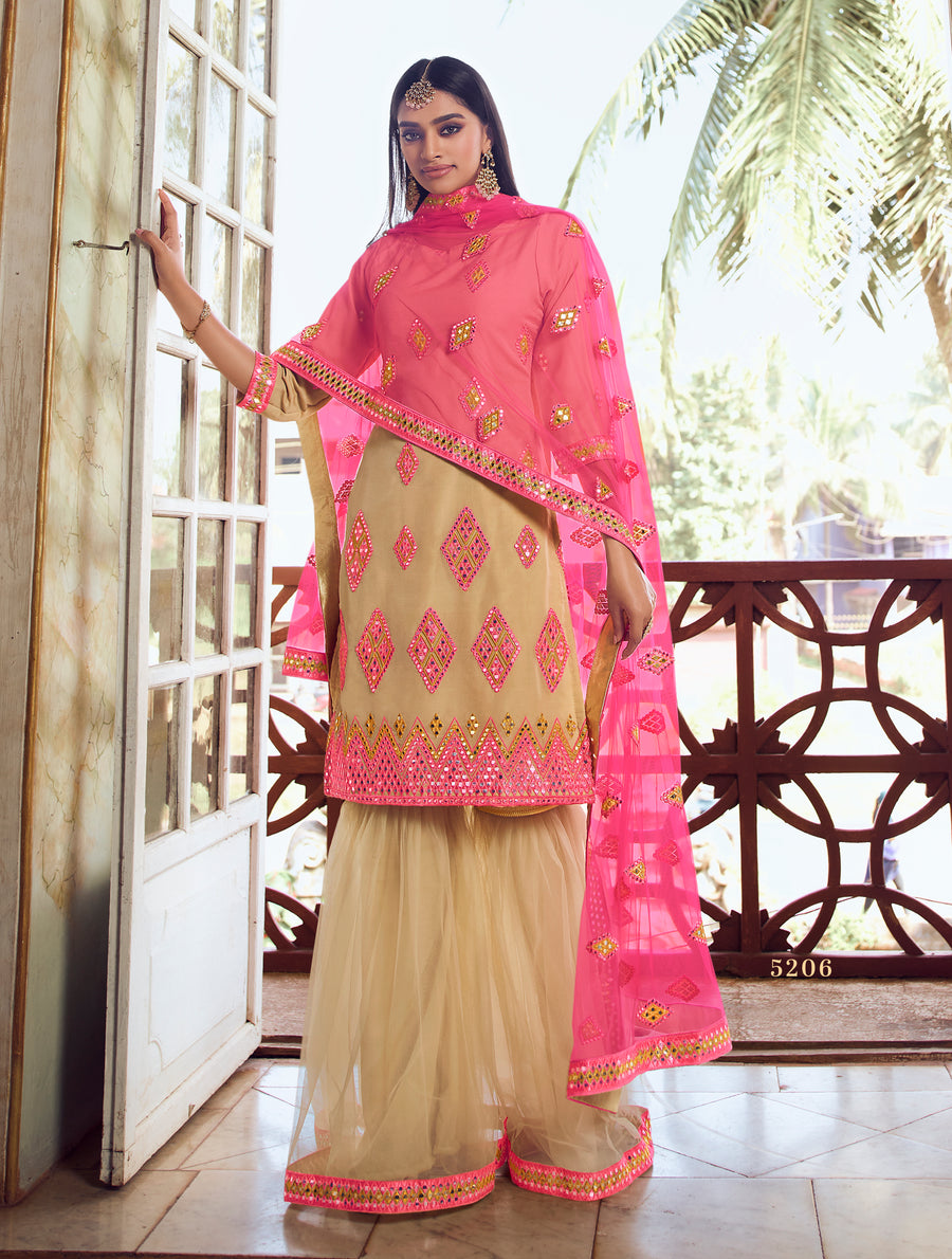 Beige and pink mirror embroidered Sharara suit with thread, zari, and foil mirror work, ideal for weddings.