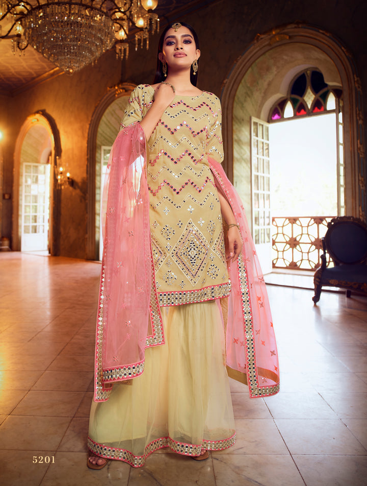 Embroidered yellow gharara suit with mirror work and zari detail