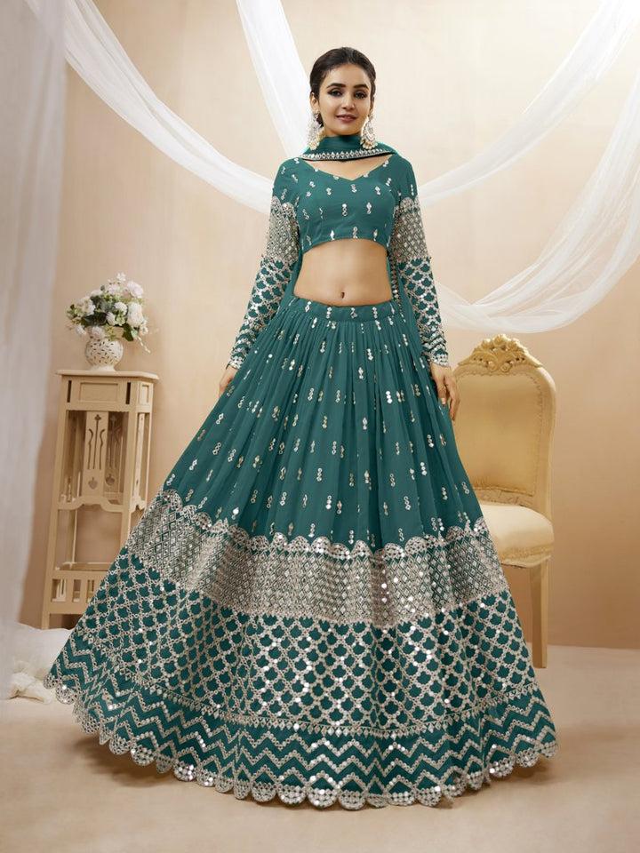 Gorgeous teal-blue georgette lehenga choli set with sequins and zari detailing, perfect for festive wear.