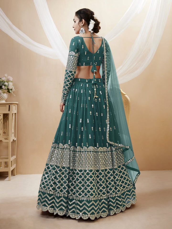 Stunning teal-blue georgette lehenga set featuring sequins and zari embroidery, perfect for cultural events.