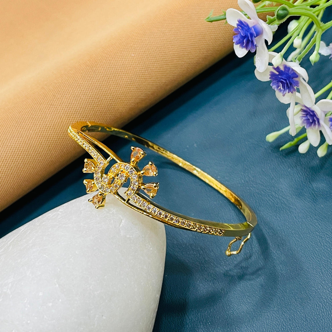 Golden bracelet with a dainty heart charm, great for gifting.