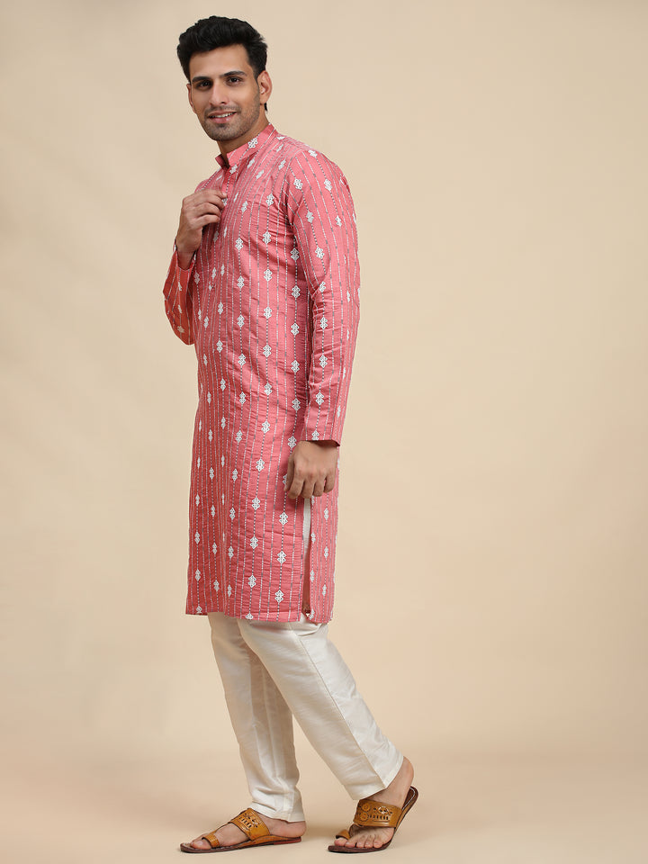 Pink woven motif kurta for men, combining elegance and tradition for weddings and festive occasions.