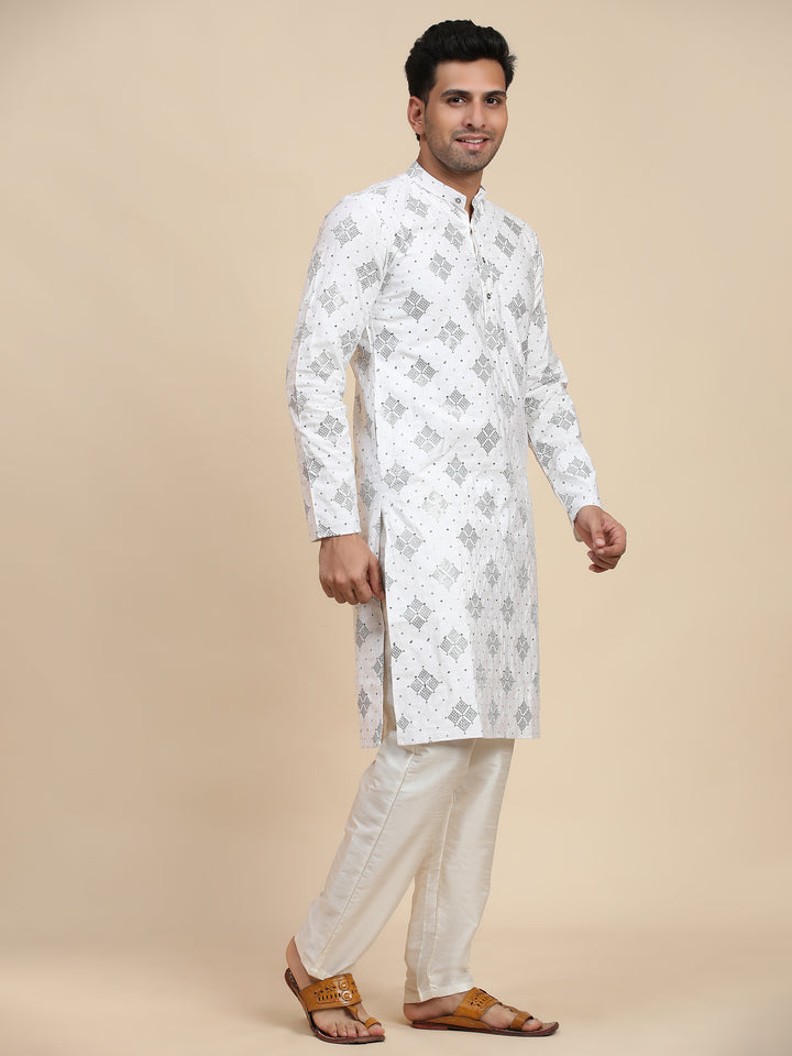 White cotton kurta set for men with intricate handwoven details, designed for celebrations and formal gatherings.