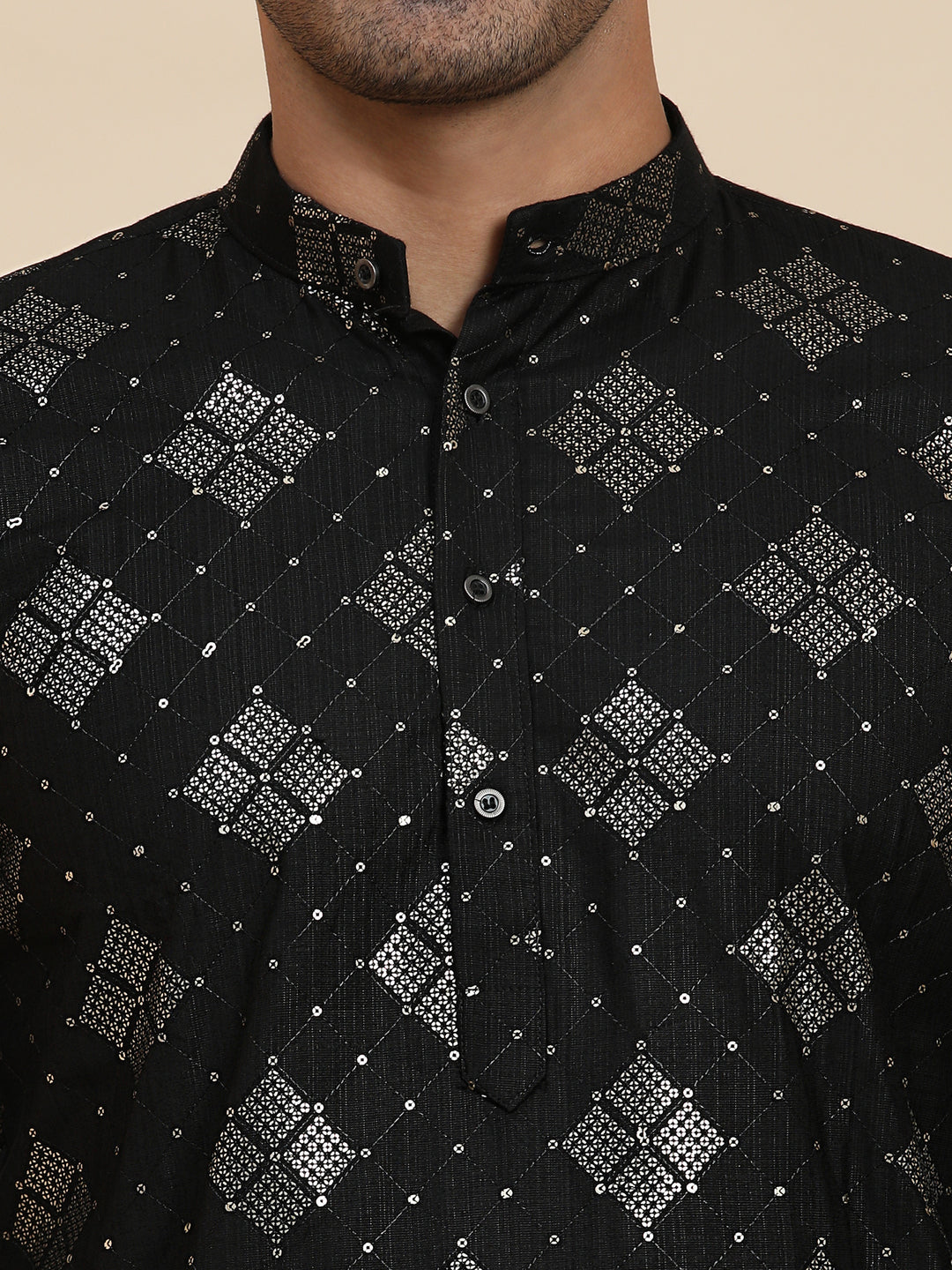 Elegant black cotton kurta with intricate detailing, designed for festivals, parties, and formal gatherings.