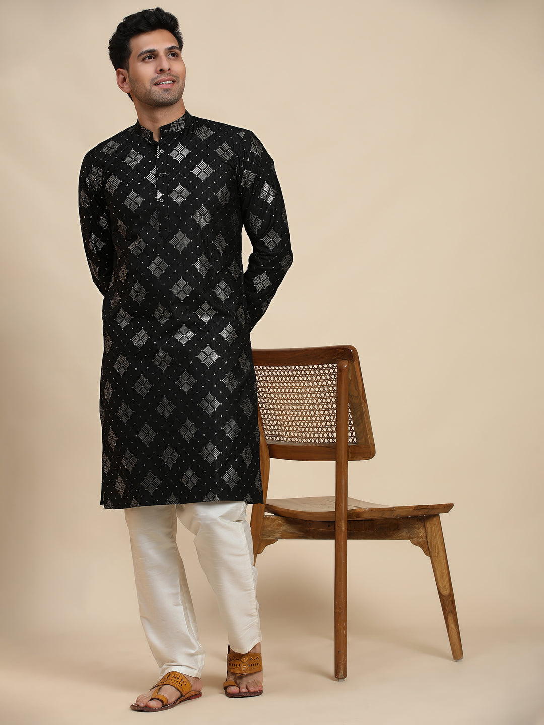 Classic black cotton kurta for men with a modern touch, ideal for celebrations and formal wear.