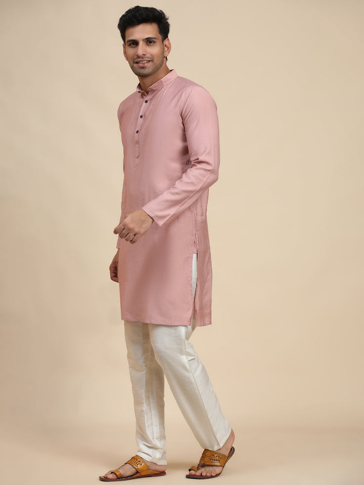 Elegant pink cotton kurta under $30, tailored for men seeking style and tradition in one outfit.