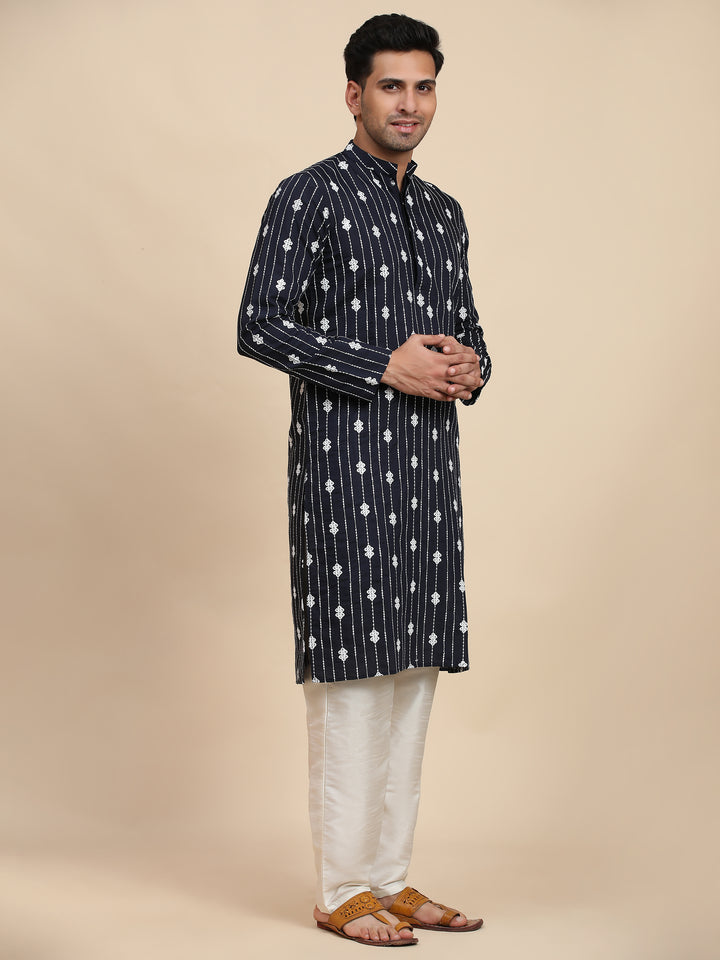 Stylish navy blue kurta with detailed weaved motifs, offering a smooth, comfortable finish for festive occasions.