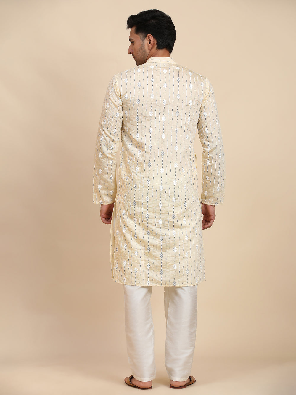 Elegant cream kurta featuring detailed weaved motifs, designed for Diwali and semi-formal occasions.