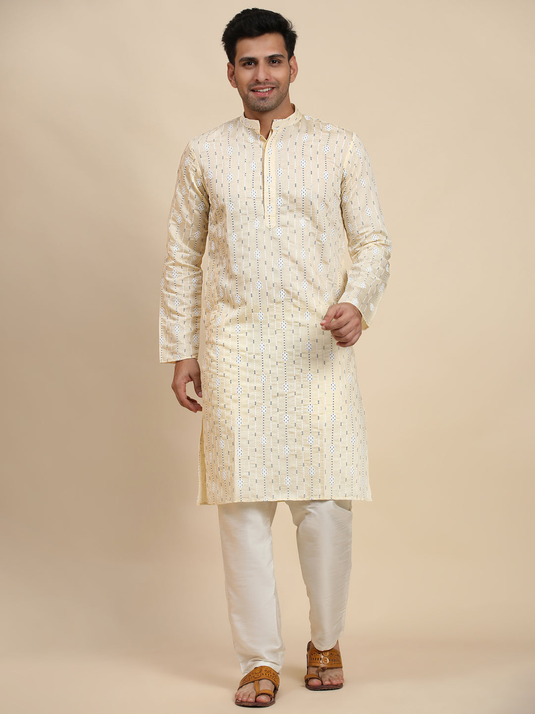 Cream-colored motif kurta crafted from viscose rayon, perfect for pooja and traditional celebrations.