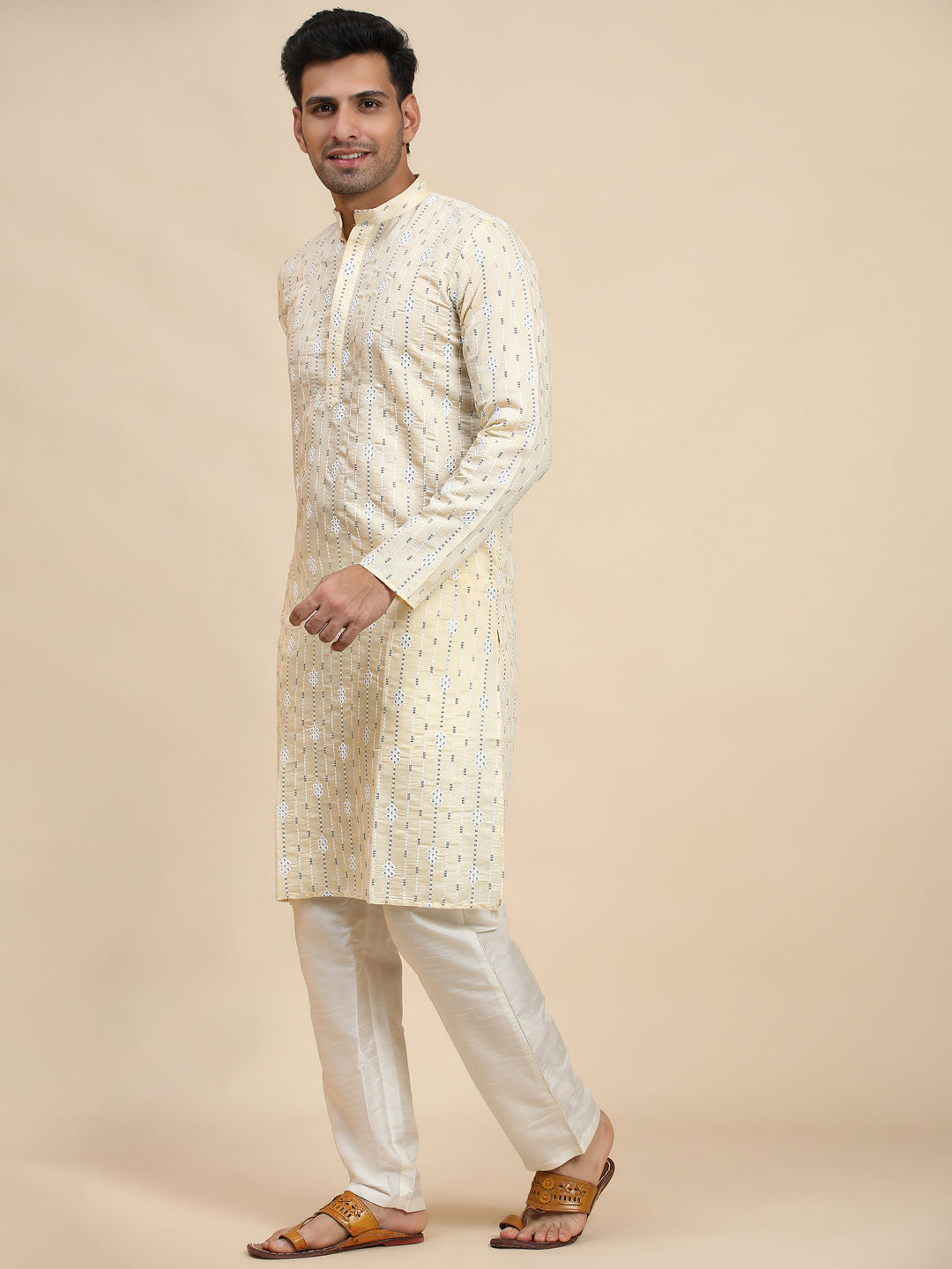 Traditional cream motif kurta made from viscose rayon, suitable for pairing with white churidar for a timeless look.