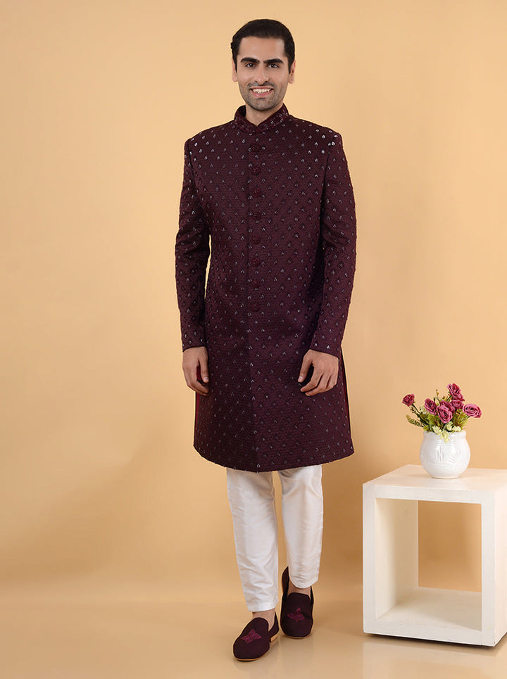 This stunning wine jacquard sherwani combines a rich hue with exquisite embroidery, perfect for adding a touch of elegance to sangeet and engagement celebrations in the USA.