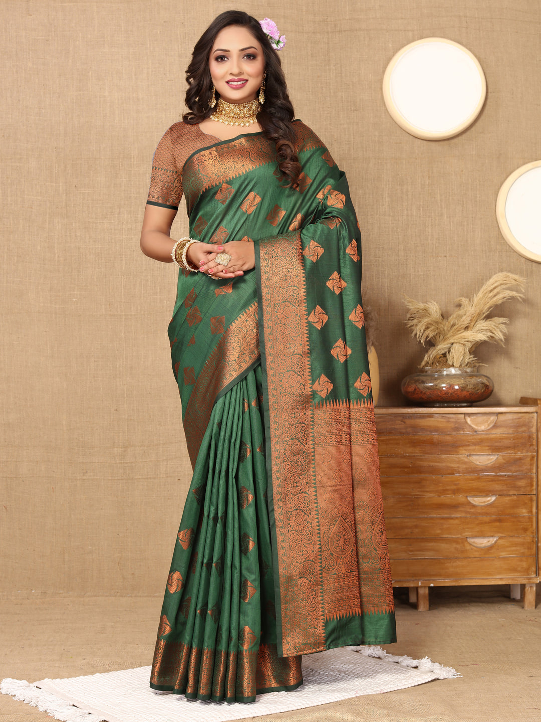 Exquisite dark green katan silk saree featuring intricate copper zari weaving and a rich zari pallu, ideal for festive occasions.