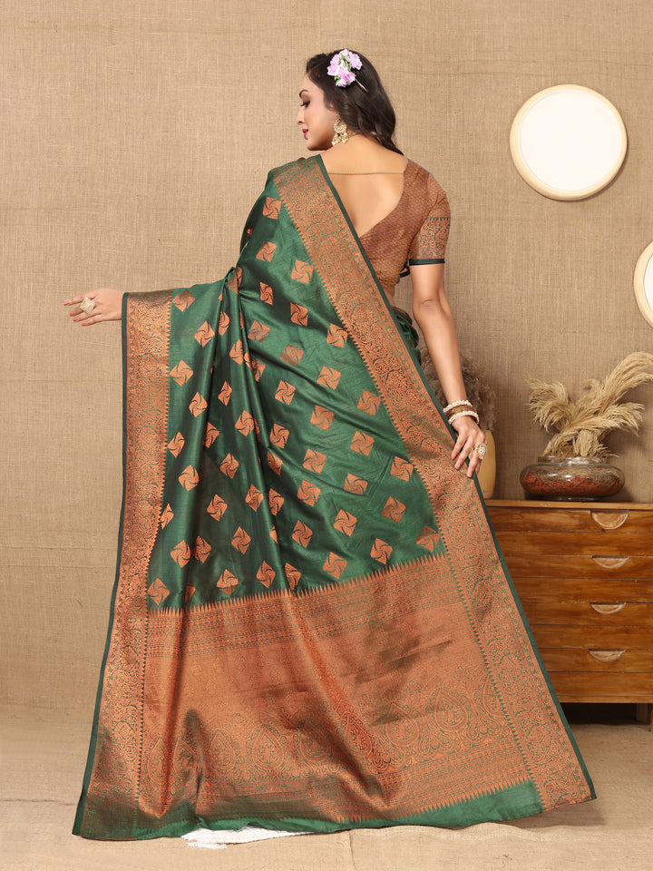 Timeless dark green katan silk saree with copper zari detailing, zari woven pallu, and matching silk blouse piece, perfect for weddings.