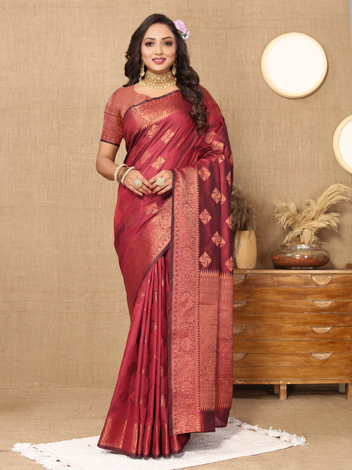 Regal maroon katan silk saree featuring intricate copper zari weaving and a zari border, designed for special occasions and weddings.