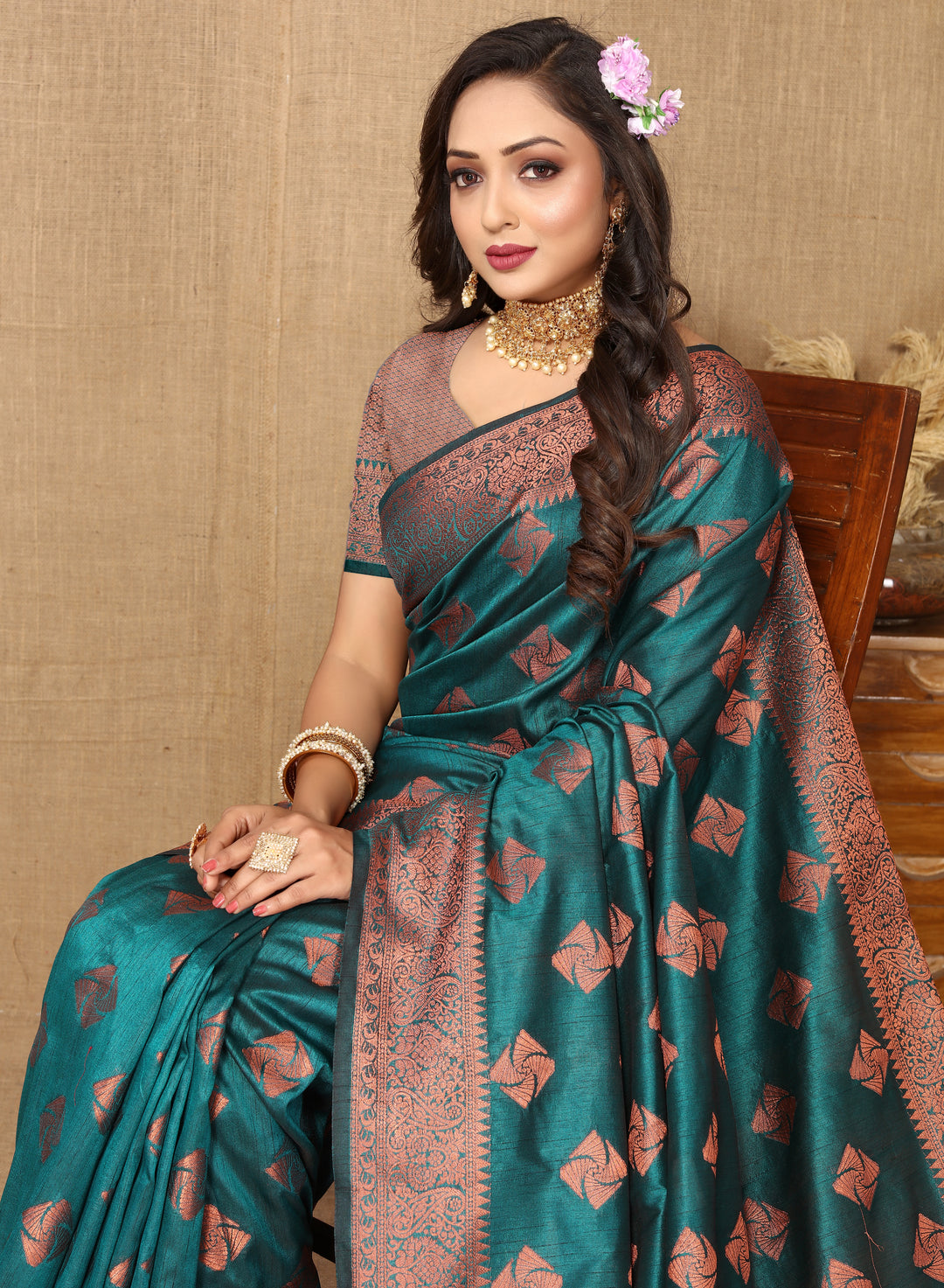 Traditional sea blue katan silk saree with intricate copper zari work and a rich zari border, perfect for cultural gatherings.