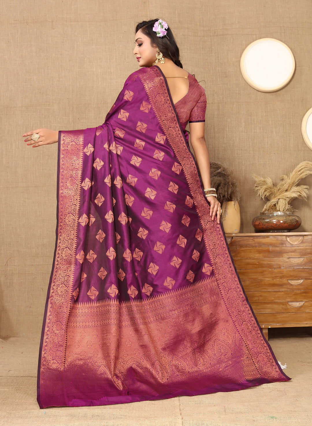 Luxurious wine katan silk saree with detailed copper zari design, zari pallu, and matching blouse, perfect for festive gatherings.