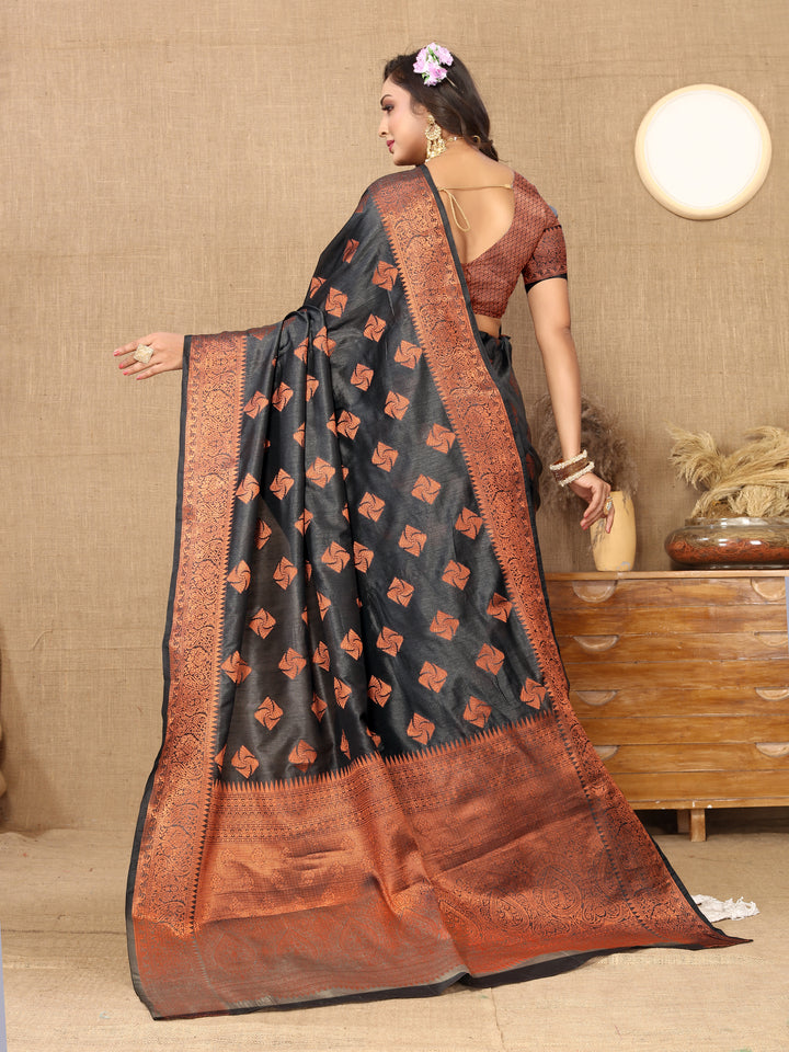 Luxurious black katan silk saree with intricate copper zari weaving and matching blouse piece, ideal for cultural and formal occasions.