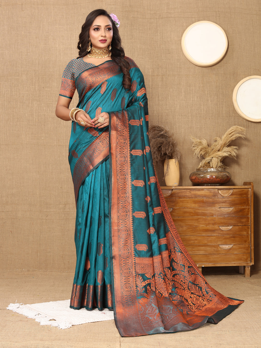 Timeless teal-blue Katan silk saree with exquisite zari border, perfect for grand occasions.