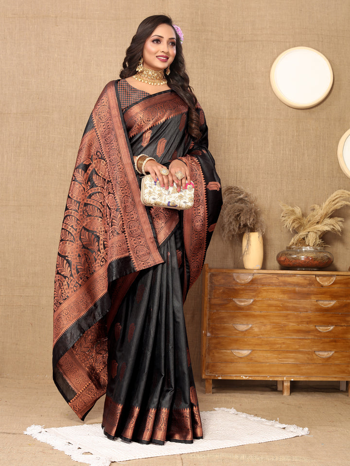 Black Katan silk saree with detailed zari border, ideal for grand celebrations.