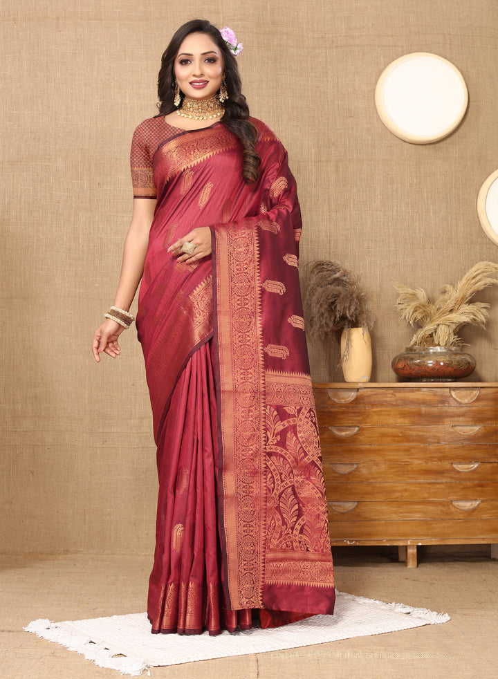 Timeless maroon silk saree featuring beautiful zari border, perfect for weddings and formal events.