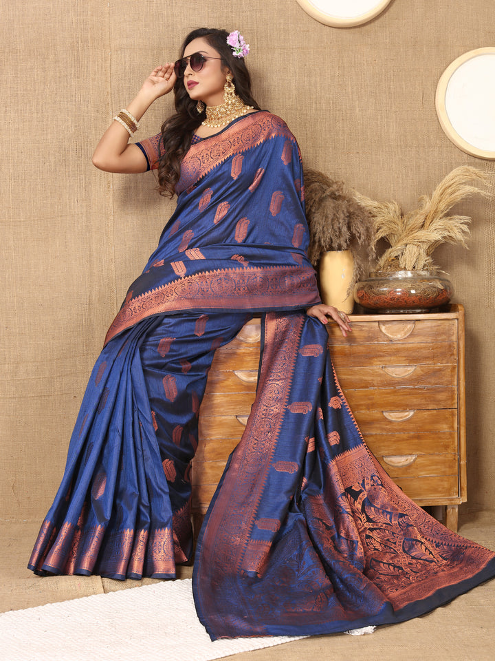 Timeless dark-green silk saree with beautiful zari border, perfect for weddings and formal events.