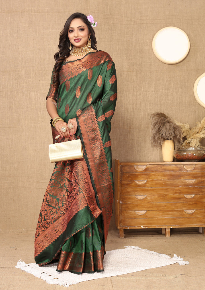 Timeless dark-green silk saree with detailed zari border, perfect for festive and formal events.