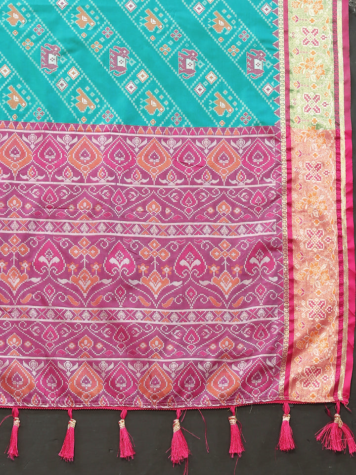 Timeless turquoise Patola silk saree featuring Meenakari and zari detailing, perfect for special celebrations.