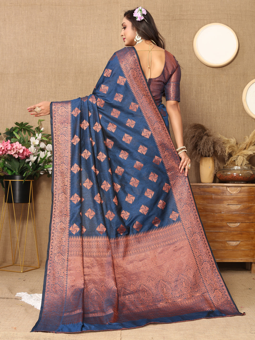 Elegant navy katan silk saree with beautiful copper zari design, matching blouse piece, and zari pallu for festive occasions.