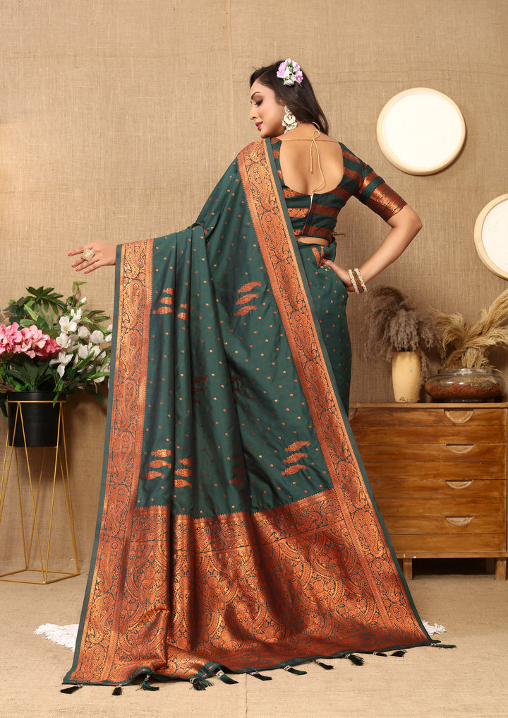 Stunning dark-green paisley saree with elegant zari pallu and contrasting border, ideal for cultural events.