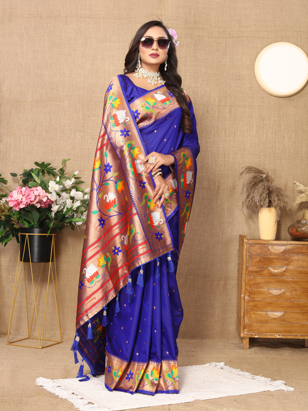 Stunning royal-blue Paithani silk saree featuring rich meenakari weaving and a beautiful zari border, perfect for weddings.