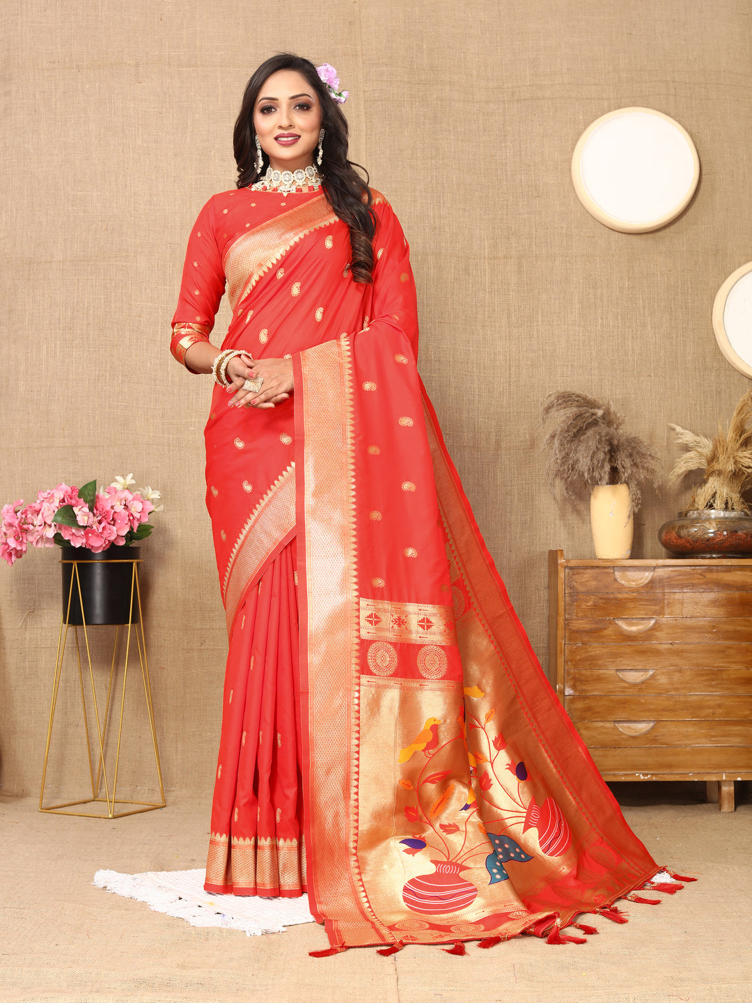 Elegant red Paithani silk saree with luxurious zari work and meenakari detailing, perfect for weddings.