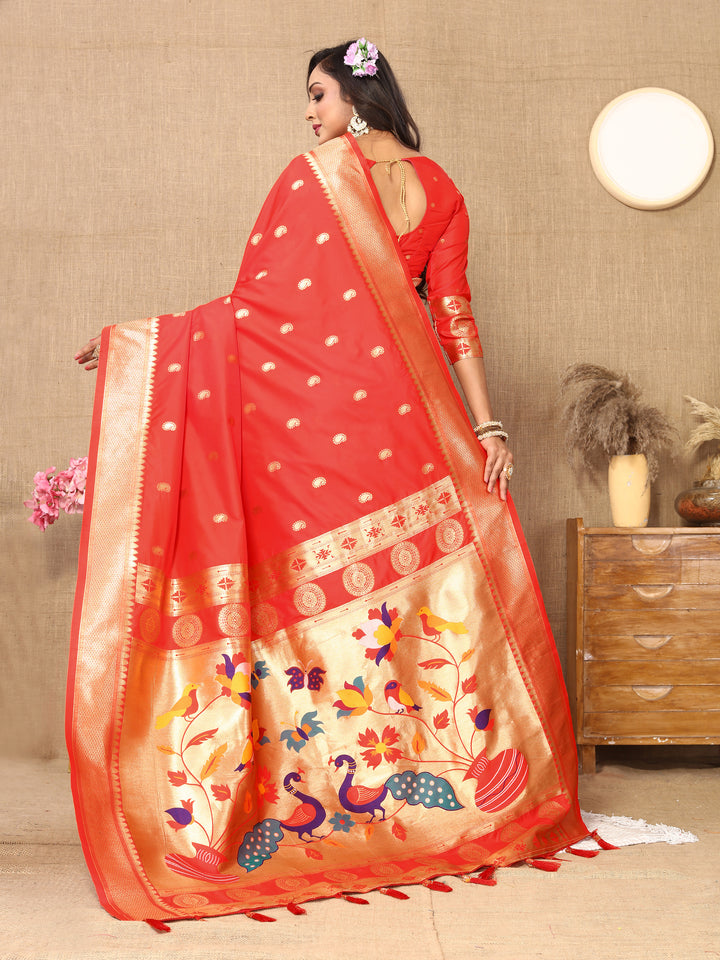 Red Paithani silk saree featuring intricate zari and meenakari designs with matching blouse for grand events.