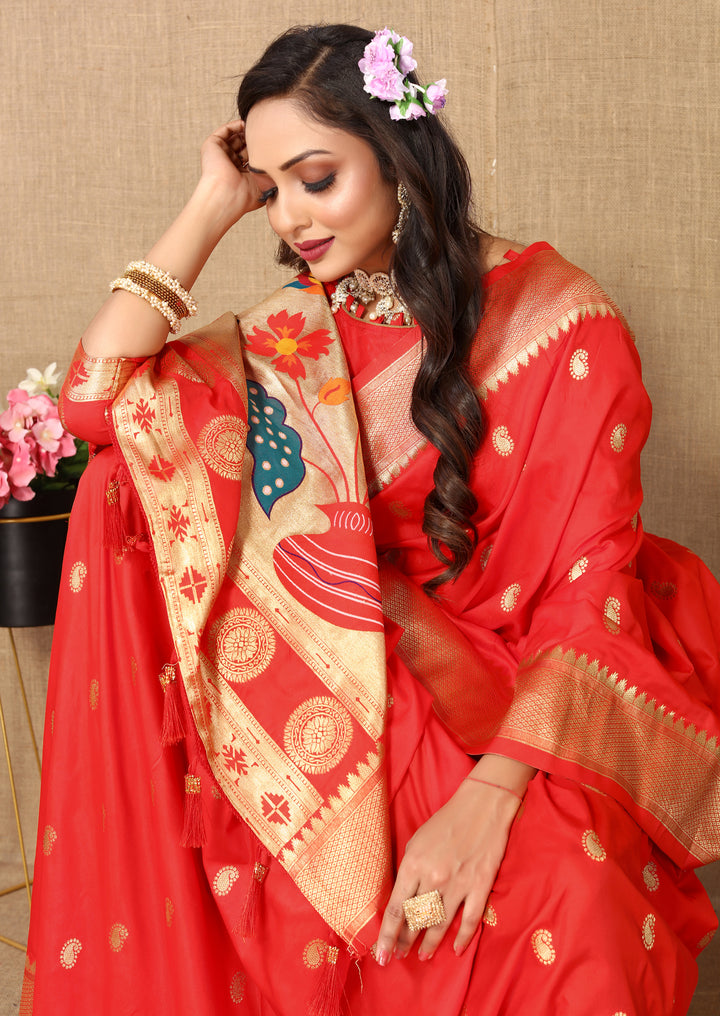 Rich red designer silk saree in Paithani style, adorned with exquisite zari and meenakari detailing.