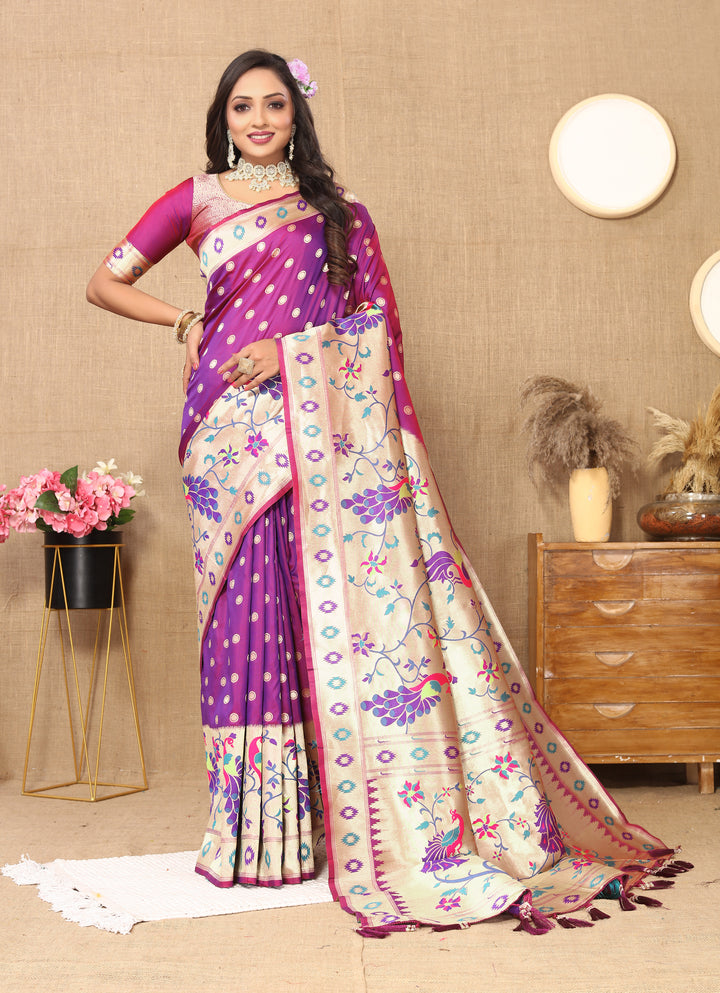 Elegant purple silk saree with intricate zari work and matching blouse piece, ideal for festive gatherings.