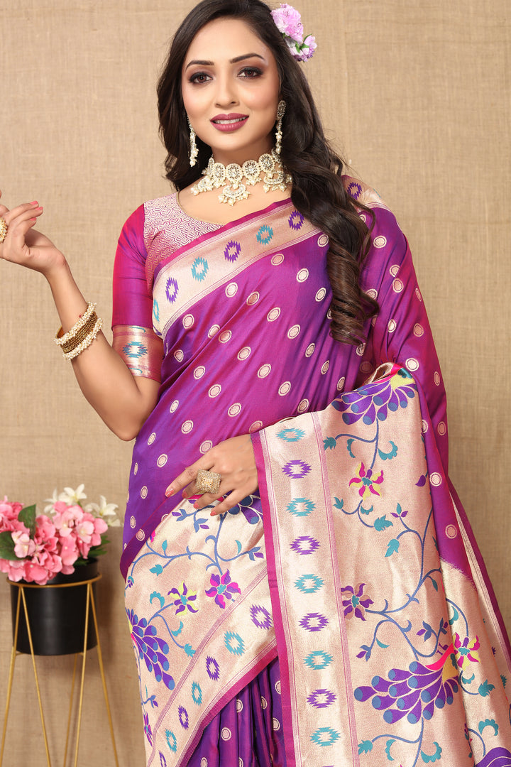 Rich purple Paithani saree featuring traditional zari weaving and a silk blouse, perfect for cultural events.