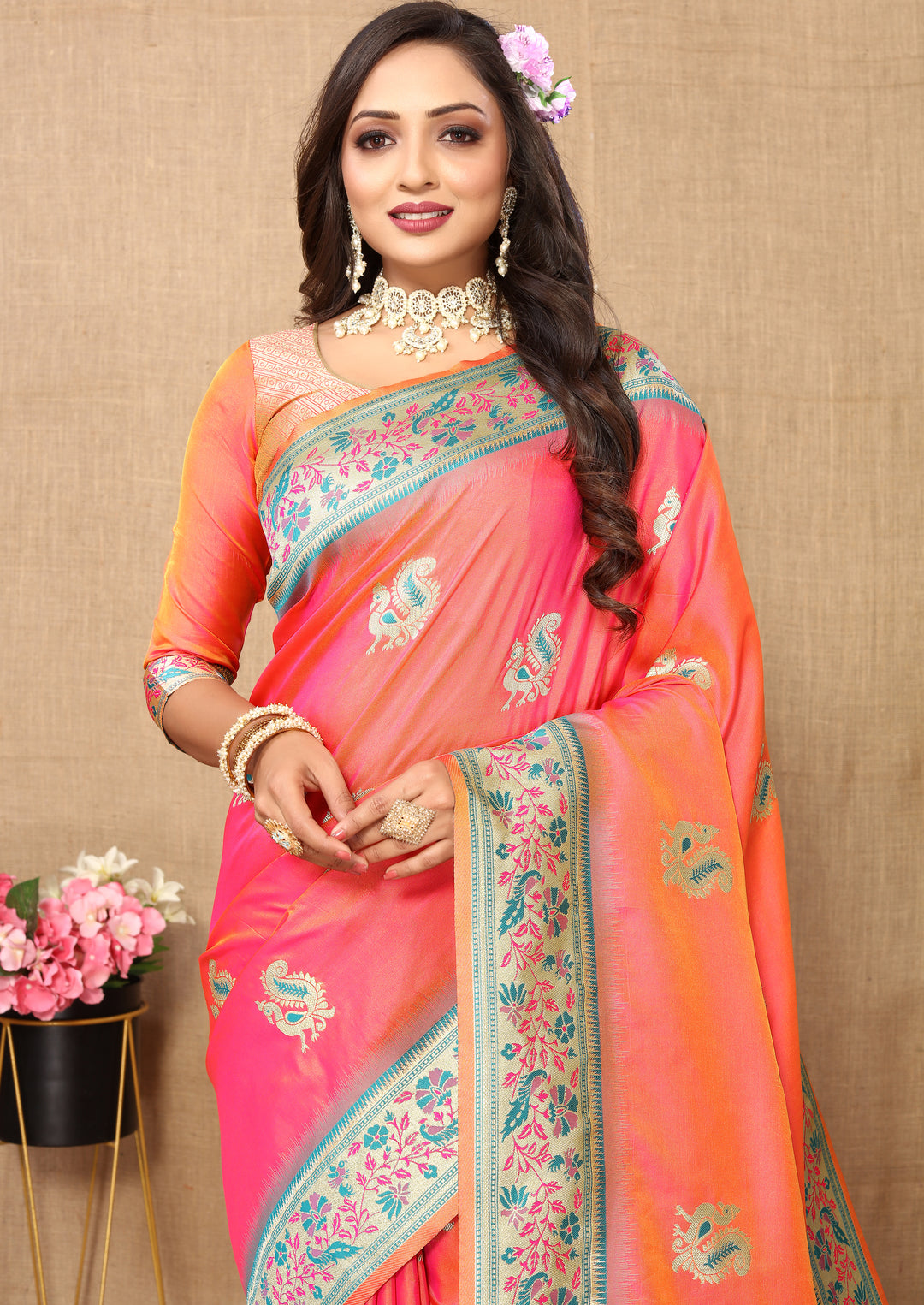 Timeless peach Paithani saree with intricate zari work and tassel details, perfect for cultural events.