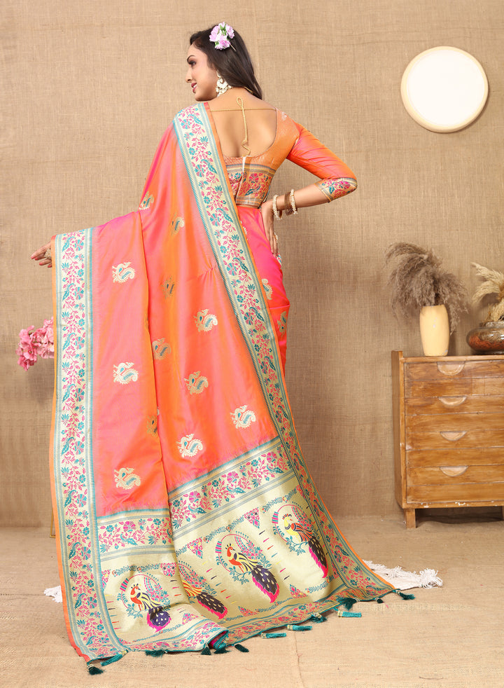 Sophisticated peach silk saree with elegant zari border and tassels, ideal for weddings.