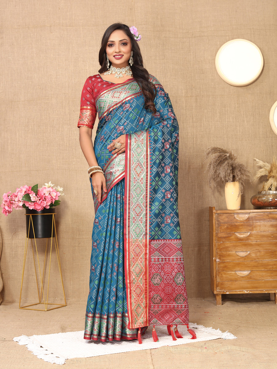 Elegant teal blue Designer Patola silk sari with detailed pallu and zari, ideal for cultural events.