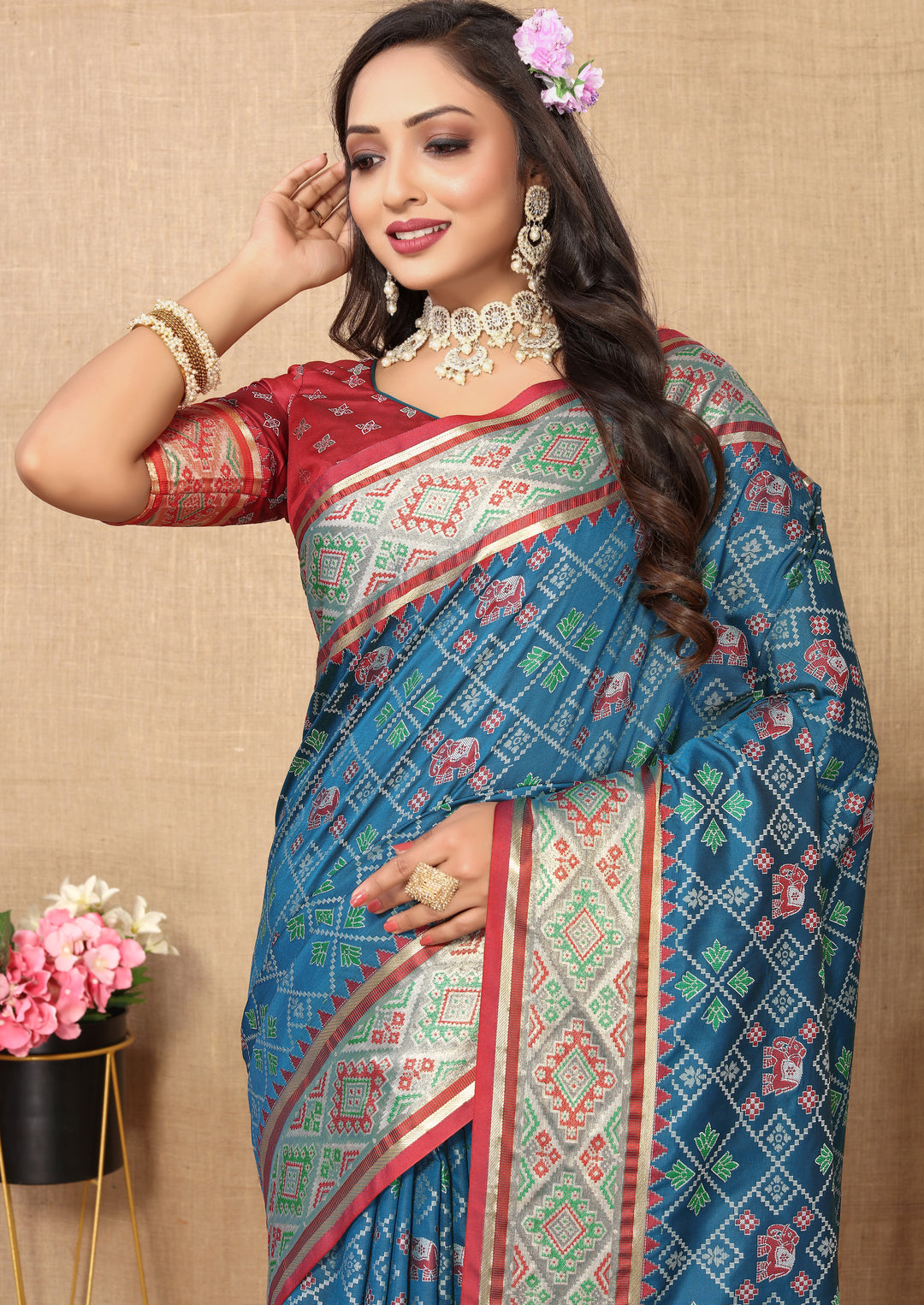 Sophisticated teal blue Patola silk sari with detailed pallu and rich zari, ideal for festive occasions.