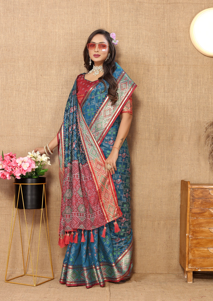 Beautiful teal blue Designer Patola silk sari with elegant zari accents and pallu, perfect for celebrations.