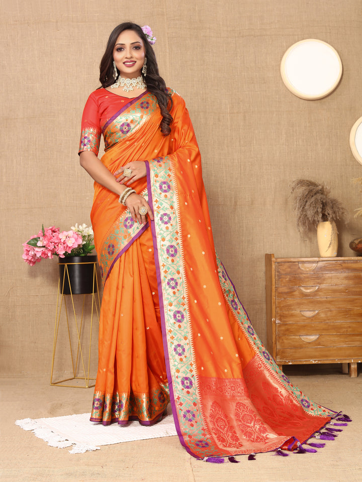 Traditional orange Paithani saree featuring a rich zari pallu and detailed Meenakari motifs.