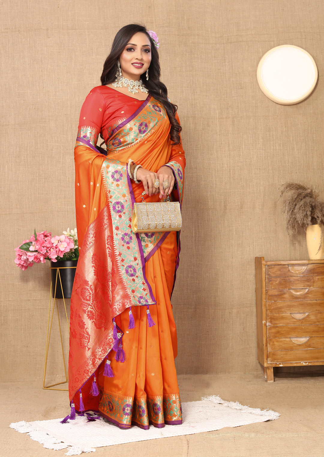 Orange Paithani silk saree with striking Meenakari weaving and luxurious zari at the pallu.