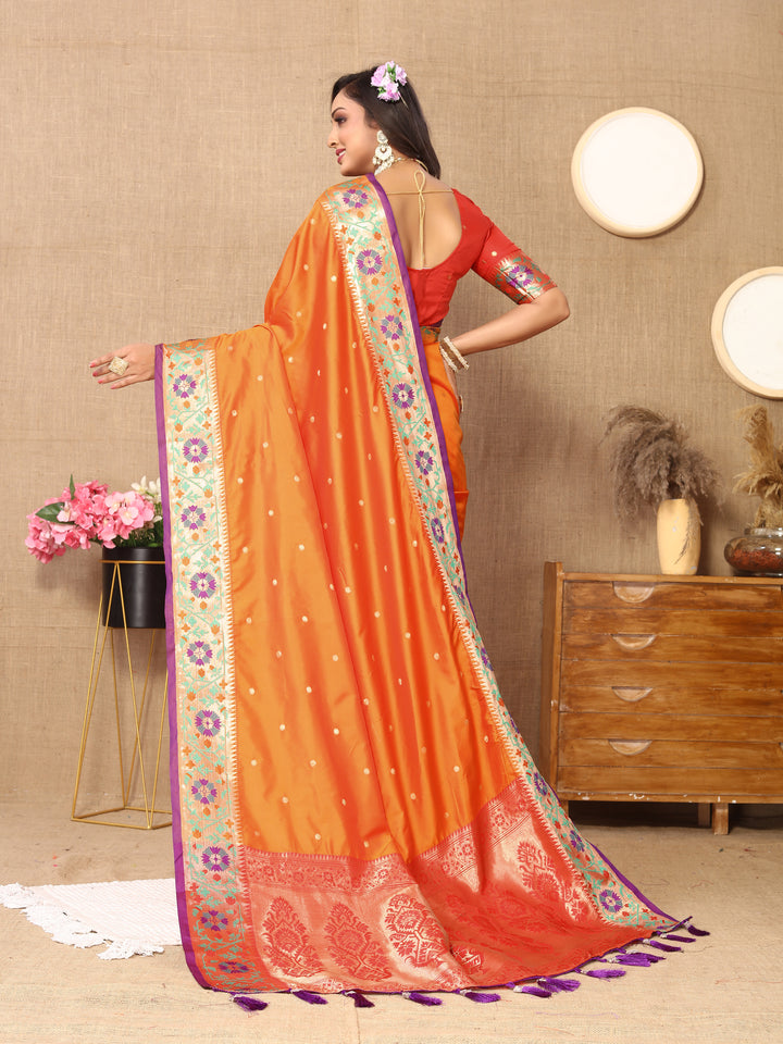 Classic orange silk saree with Meenakari weaving, complemented by a stunning zari pallu.