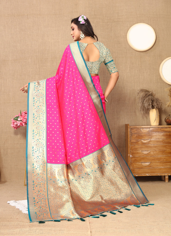 Soft Pink Silk Saree with intricate zari design and a luxurious brocade blouse for festive occasions.