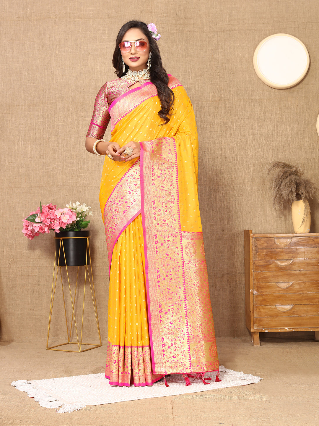 Vibrant Yellow Soft Silk Saree with zari weaving and a luxurious brocade blouse for celebrations.