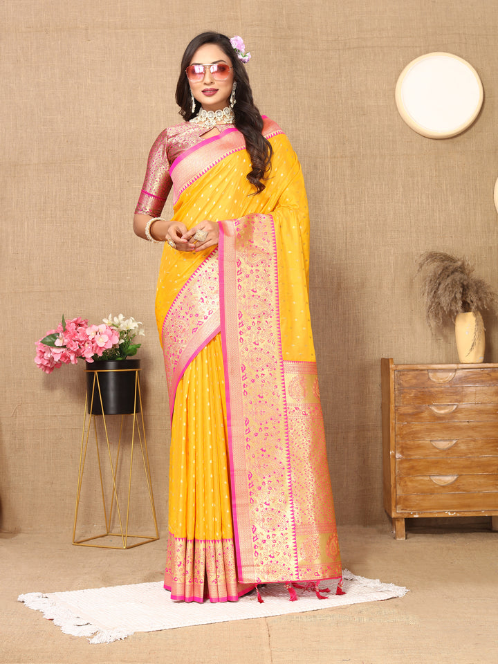 Vibrant Yellow Soft Silk Saree with zari weaving and a luxurious brocade blouse for celebrations.