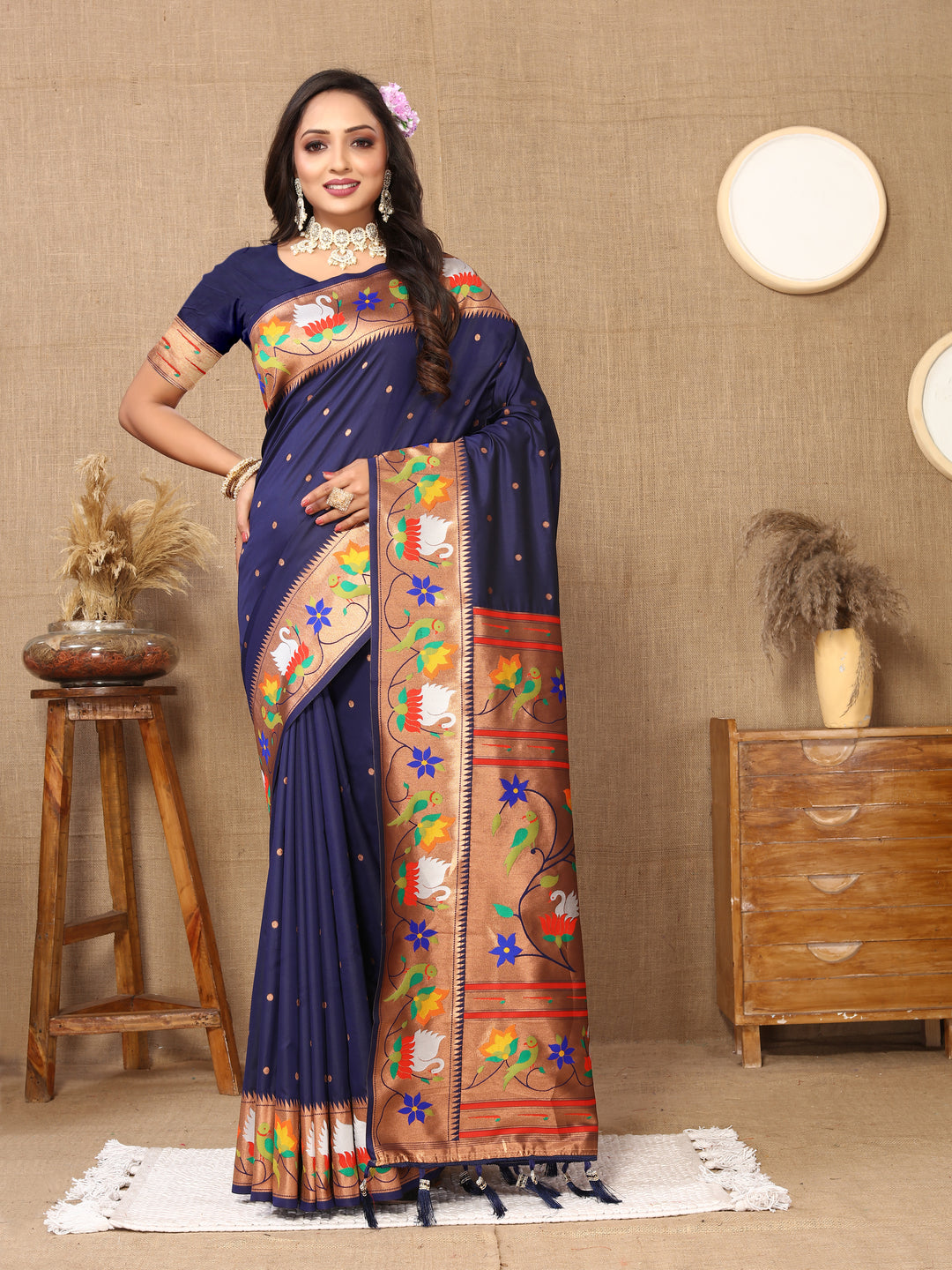 Gorgeous navy Paithani silk saree featuring rich meenakari weaving and a stunning zari border, ideal for bridal wear.